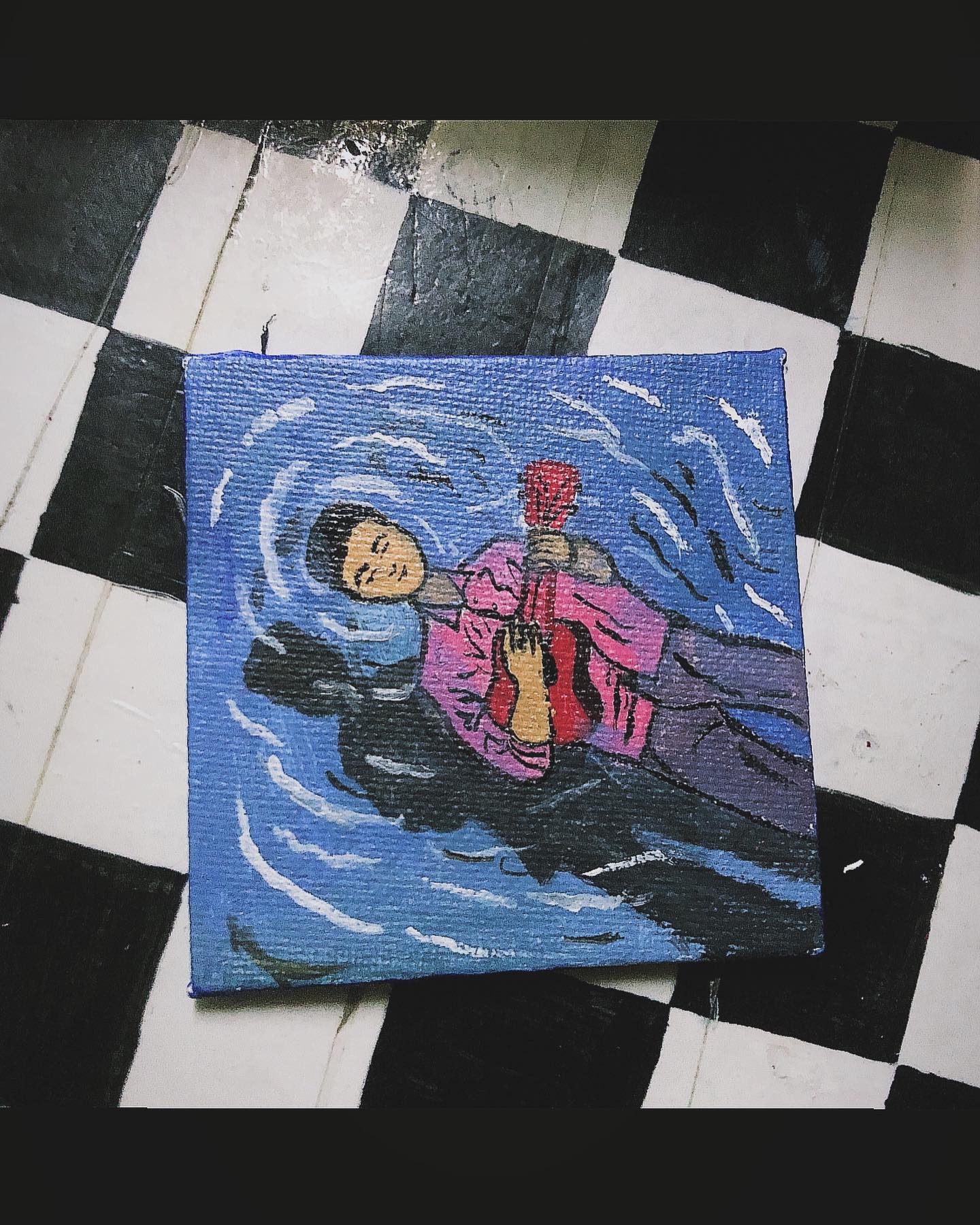 Small painting of a figure floating in dark blue water with a red guitar.