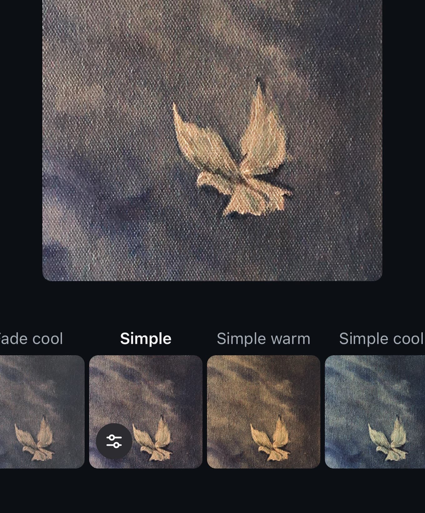 Small gold moth painting on dark canvas shown above a row of warm and cool color-grade variations.